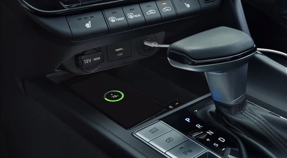 Cellphone charging in the center console area in a 2026 Hyundai Elantra.