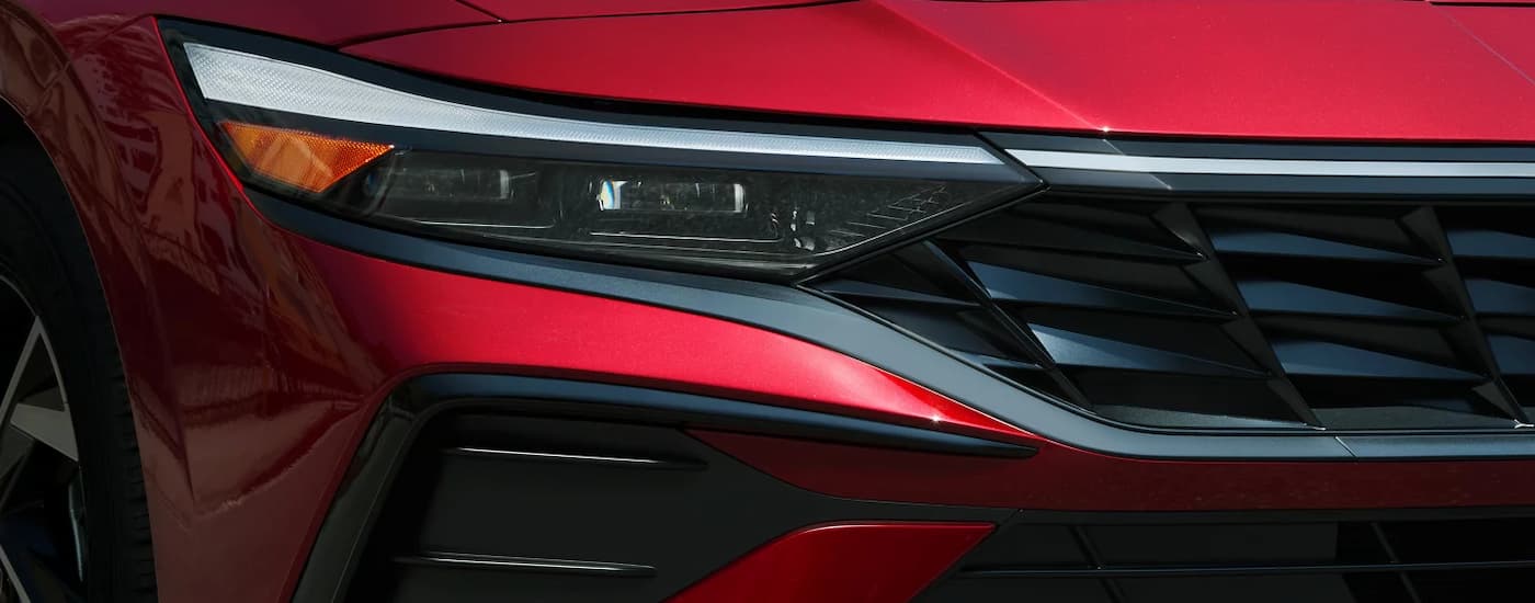 Headlight and grille on a red 2026 Hyundai Elantra