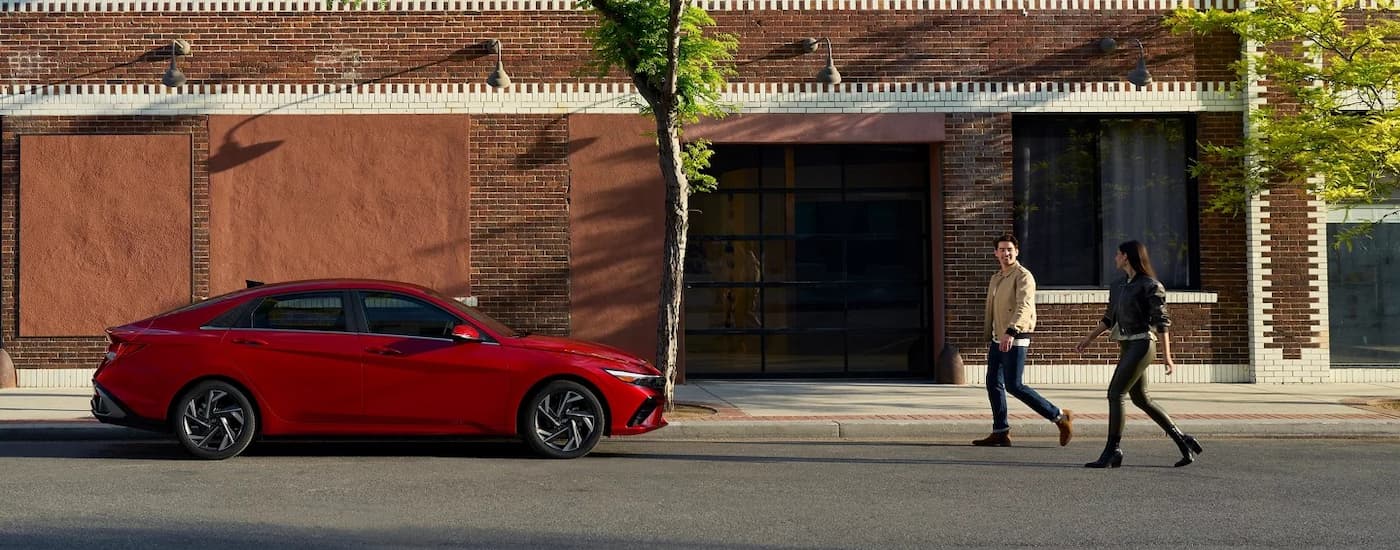 Red 2026 Hyundai Elantra parked on the side of a street