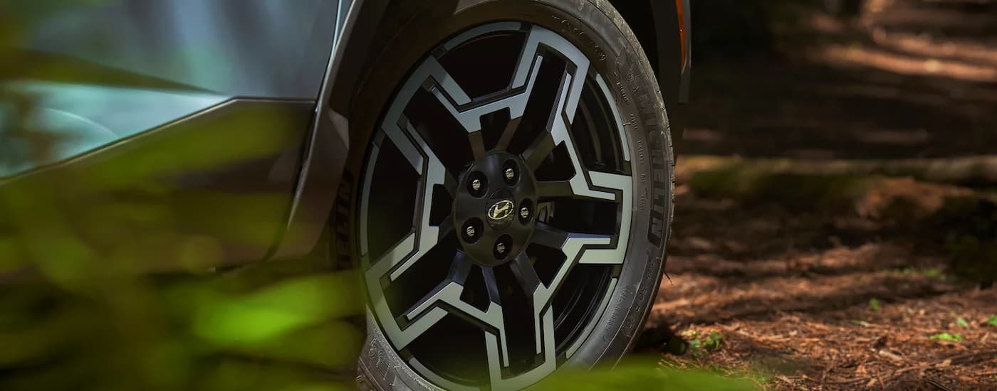 Tire and rim on a blue 2026 Hyundai Santa Cruz