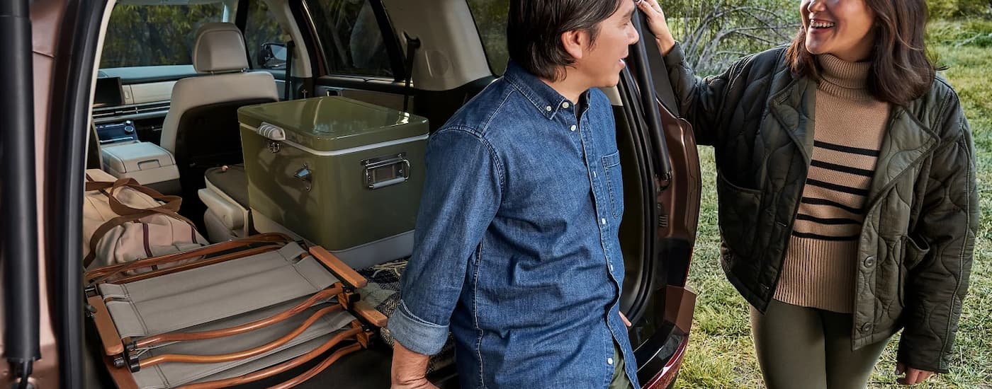 Family standing outside of a 2026 Hyundai Santa Fe